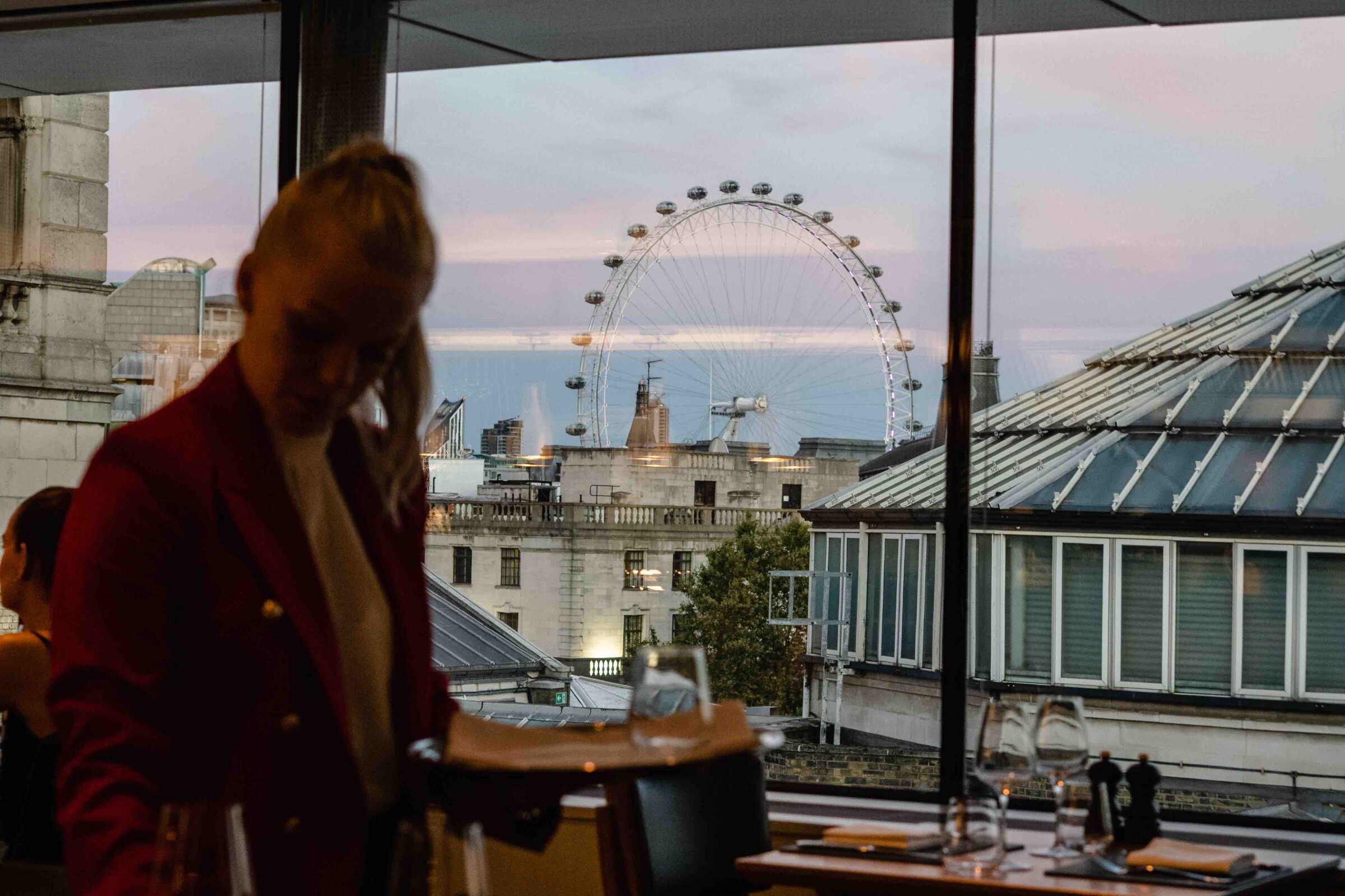 The Portrait Restaurant by Richard Corrigan dining room with London Eye and Westminster skyline view at sunset